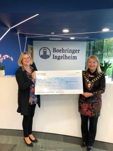 Cllr Ingham receiving cheque from Boehringer Ingelheim